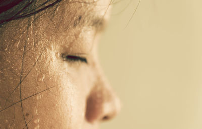 Close-up of woman with sweat on face