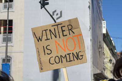 Sign saying winter is not coming in protest for climate changes