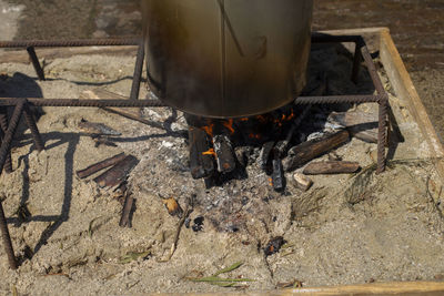 High angle view of fire on barbecue grill