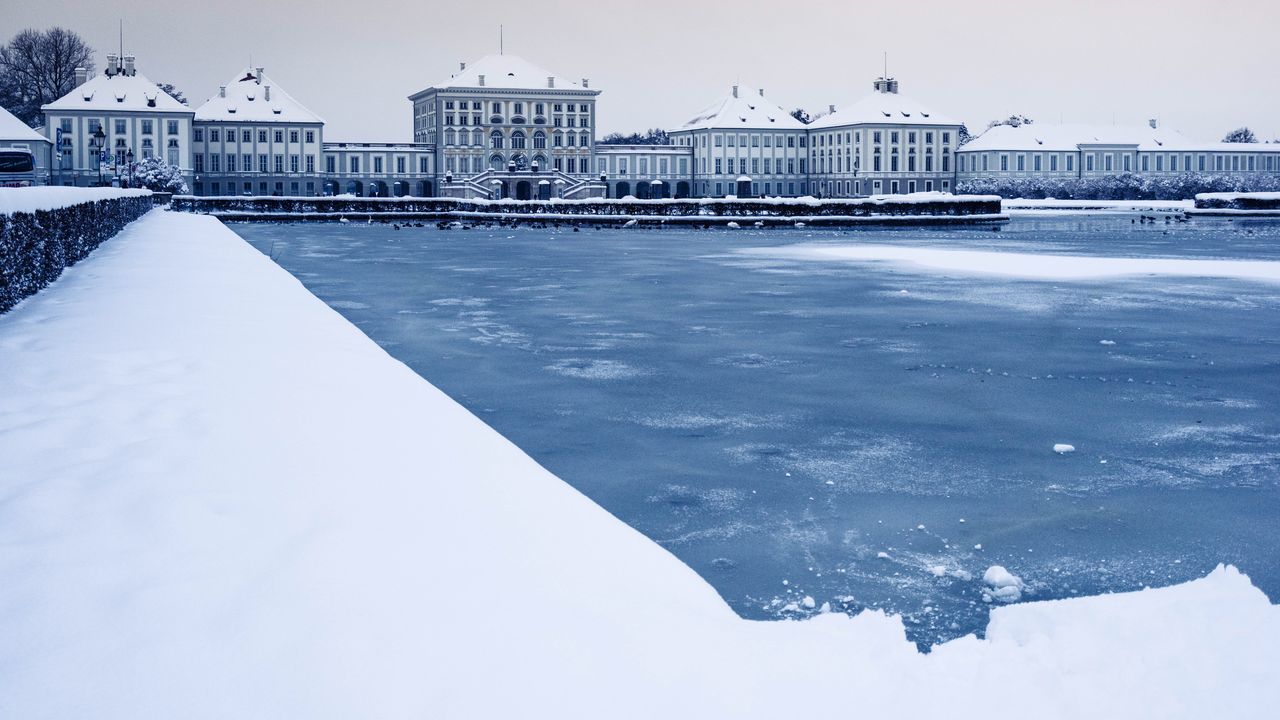 water, architecture, built structure, building exterior, sea, clear sky, snow, waterfront, day, cold temperature, beach, outdoors, winter, nature, incidental people, sky, blue, pier, no people, nautical vessel