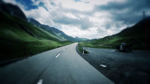 View of road against cloudy sky