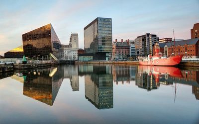 Modern buildings at albert dock against sky