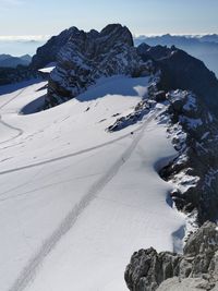 Scenic view of snowcapped mountains against sky