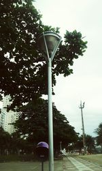 Low angle view of street light against sky