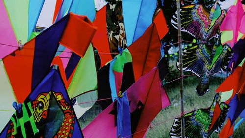 Full frame shot of multi colored umbrellas hanging at market stall