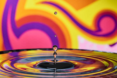 Close-up of drop splashing in water