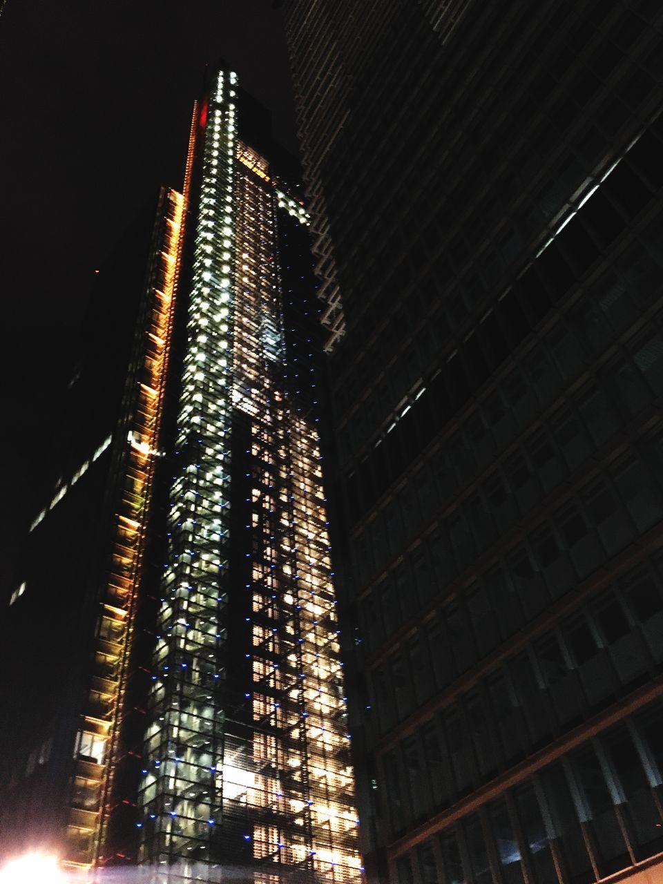 illuminated, night, building exterior, architecture, low angle view, built structure, modern, skyscraper, travel destinations, city, no people, sky, outdoors