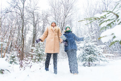 People on snow covered land