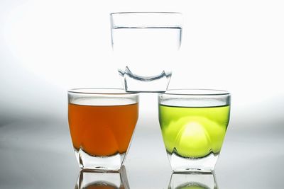 Close-up of beer glass against white background