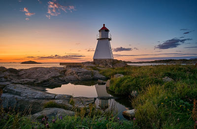 Glorious sunset with lighthouse, vigra, norway
