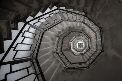 Low angle view of spiral staircase in building