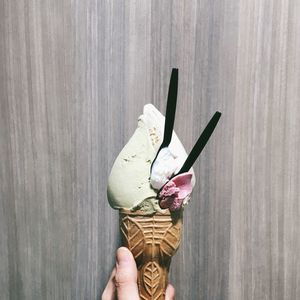 Cropped hand of person holding ice cream cone