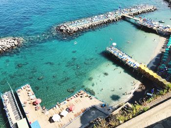 High angle view of boats moored at harbor