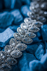 Close-up of diamond necklace on stones