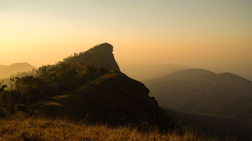 Scenic view of mountains against sky during sunset