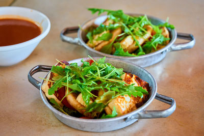 High angle view of salad in bowls on table