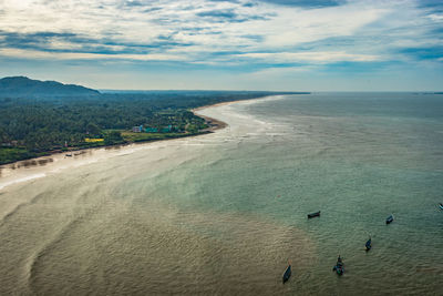 Beach isolated with fishing boats aerial shots with dramatic sky