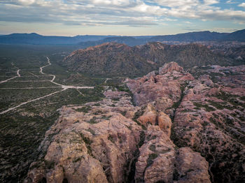 View of mountain range against cloudy sky