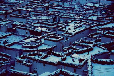 High angle view of snow covered roof and buildings