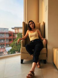 Portrait of smiling young woman at home