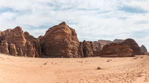 Panoramic view of rock formations against sky