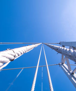 Low angle view of bridge against blue sky