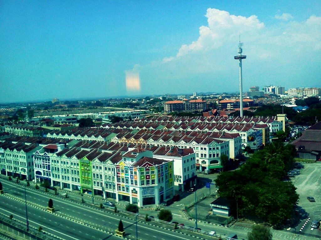 building exterior, architecture, built structure, city, cityscape, high angle view, illuminated, sky, blue, crowded, communications tower, residential district, city life, tower, travel destinations, residential building, street, capital cities, road, tall - high