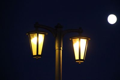 Low angle view of illuminated street light