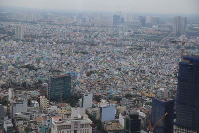 High angle view of buildings in city against sky