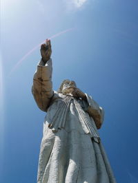 Low angle view of statue against blue sky