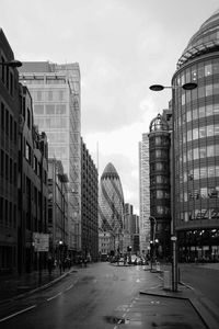 Buildings in city against sky