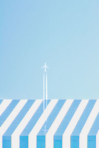 Low angle view of communications tower against clear sky