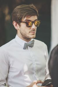 Close-up of young man wearing sunglasses