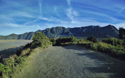 Scenic view of landscape and mountains against sky