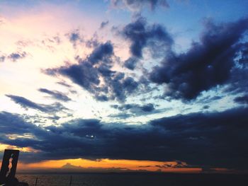 Low angle view of dramatic sky during sunset
