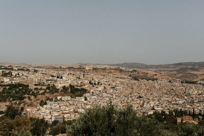 Aerial view of town against clear sky