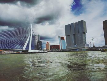 Buildings against cloudy sky