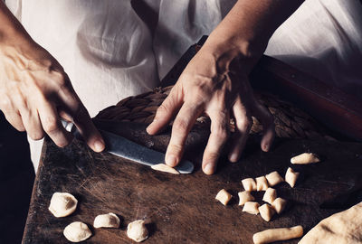 Midsection of man preparing food