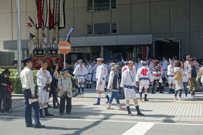 People walking on street in city