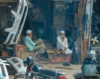 People working at market stall