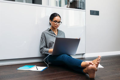 Woman working on laptop at home