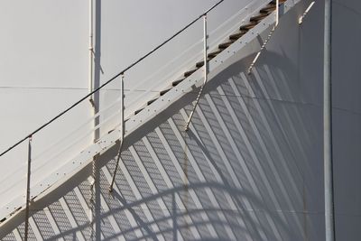 Shadow of railing on staircase against wall