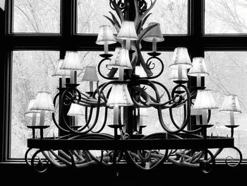 Close-up of bicycle on table against window