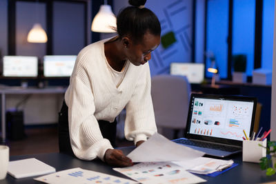 Woman working late in office