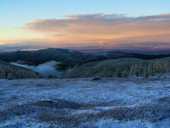 Scenic view of mountains against sky during sunset