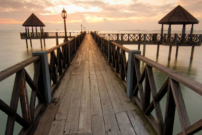 Surface level of wood paneled jetty at calm sea