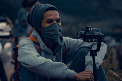 Close-up of man photographing outdoors