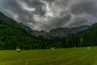 Scenic view of landscape and mountains against sky