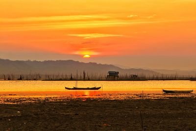 Scenic view of silhouette land against sky during sunset