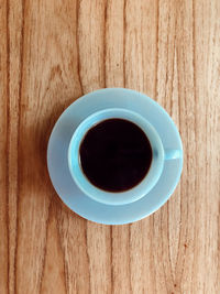 High angle view of black coffee on table